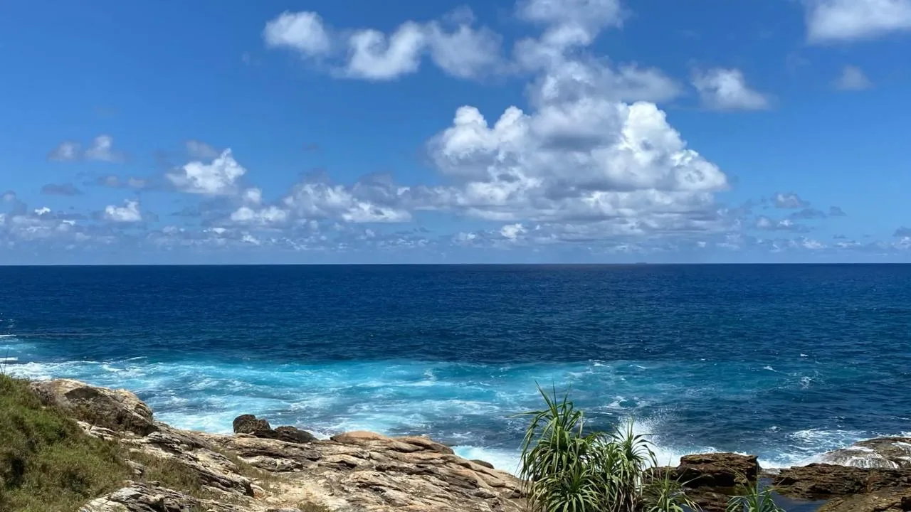 Waves breaking on the rocky ocean side of Blue Beach Island, Dikwella