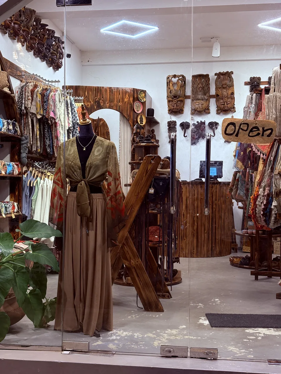 Boutique shop with handloom garments and wooden masks in Hiriketiya