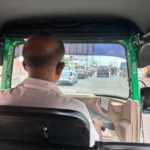 Riding in a tuk-tuk booked through a ride-hailing app in Colombo