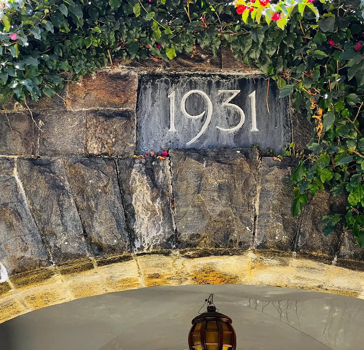 The 1931 datestone set into the stone wall of Adisham Bungalow