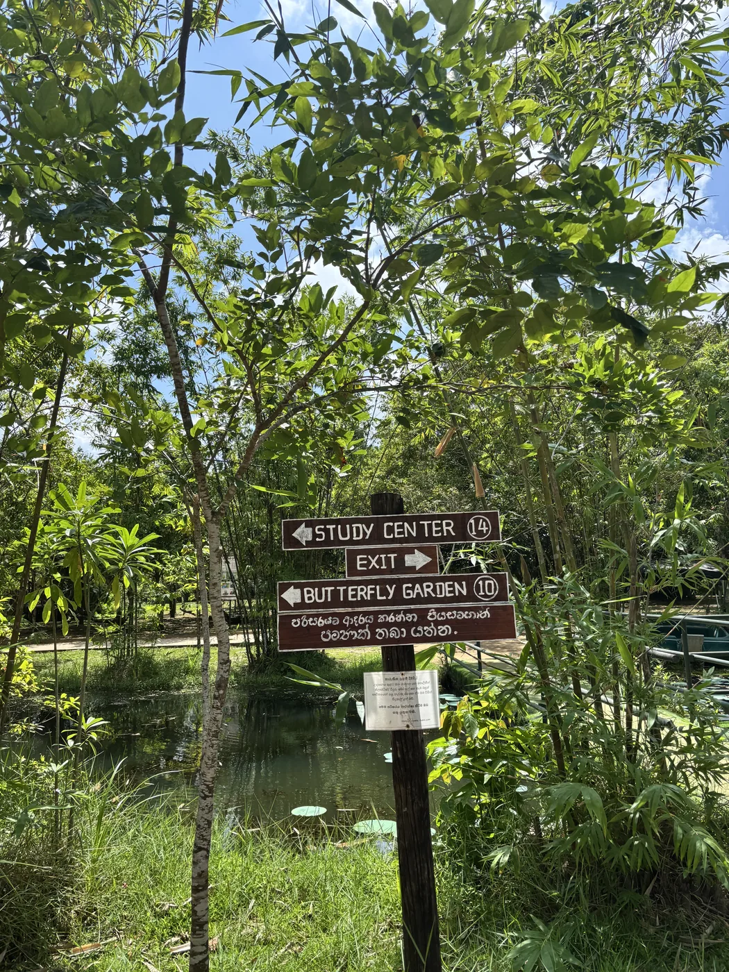 Signpost to the study center and butterfly garden inside Diyasaru Park