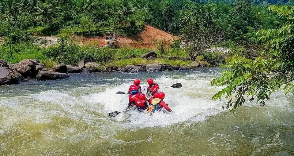 A raft crossing white water on the Kelani River at Kitulgala