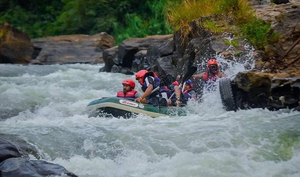 A raft punching through one of the seven rapids at Kitulgala