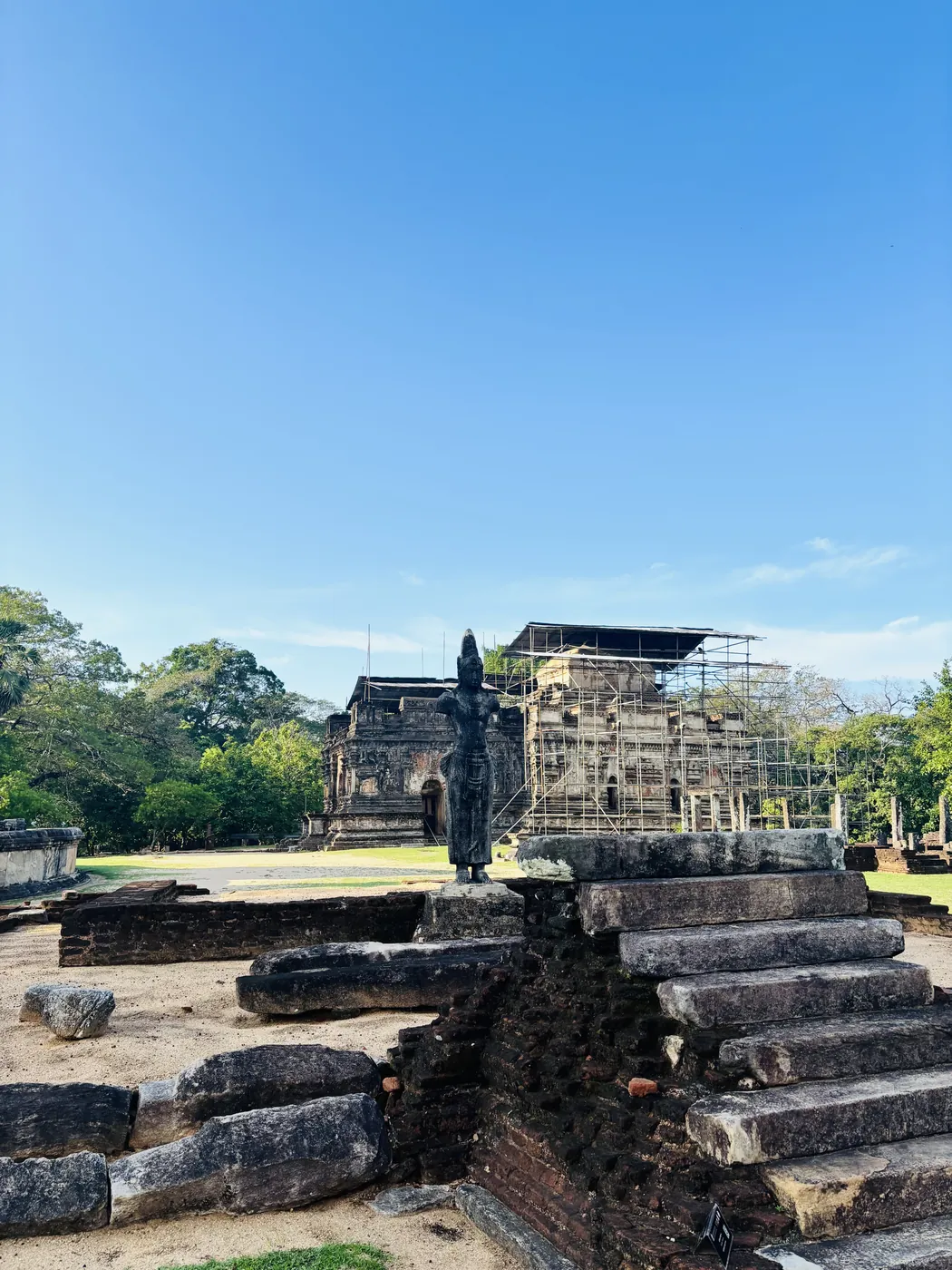 Ancient stone statue among the ruins of the Sacred Quadrangle in Polonnaruwa