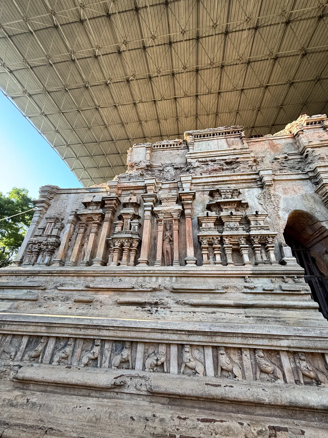 Intricately carved stone and brick facade of the Thivanka Pilgrimage House at Polonnaruwa